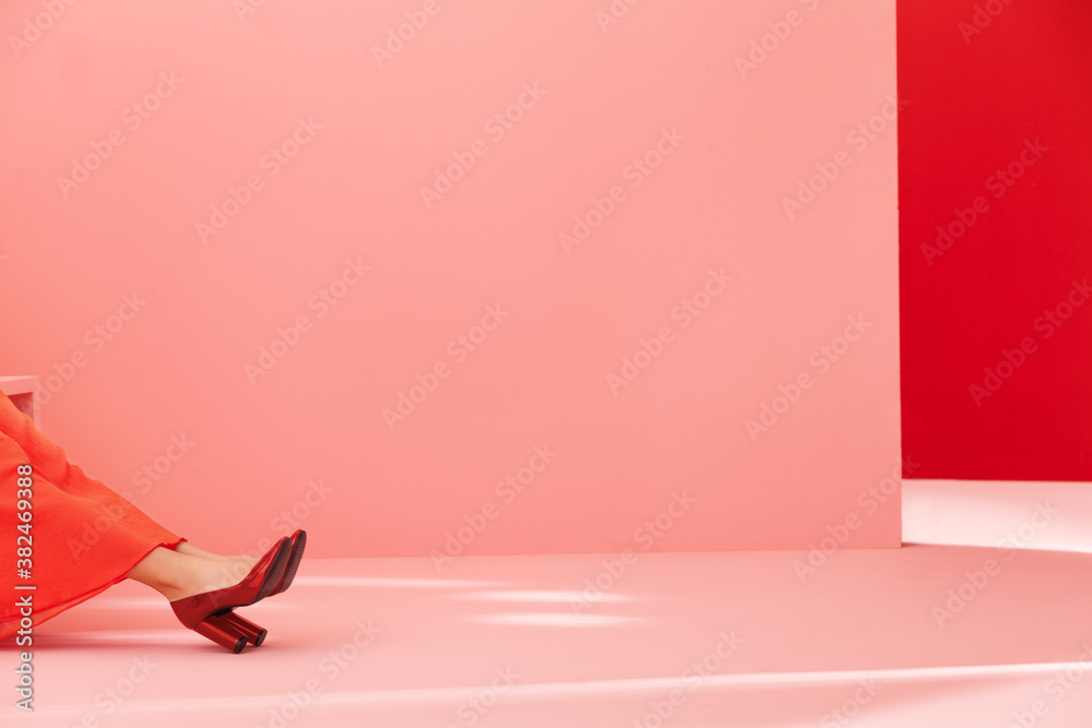 conceptual image with high heels and red and pink walls conceptual image with high heels and red and pink walls
