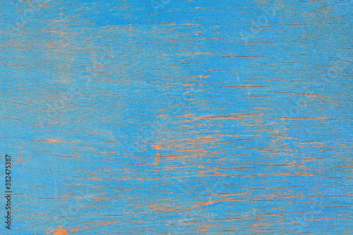 Wood surface with blue weathered paint. Background.