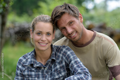 a happy couple in a field © auremar