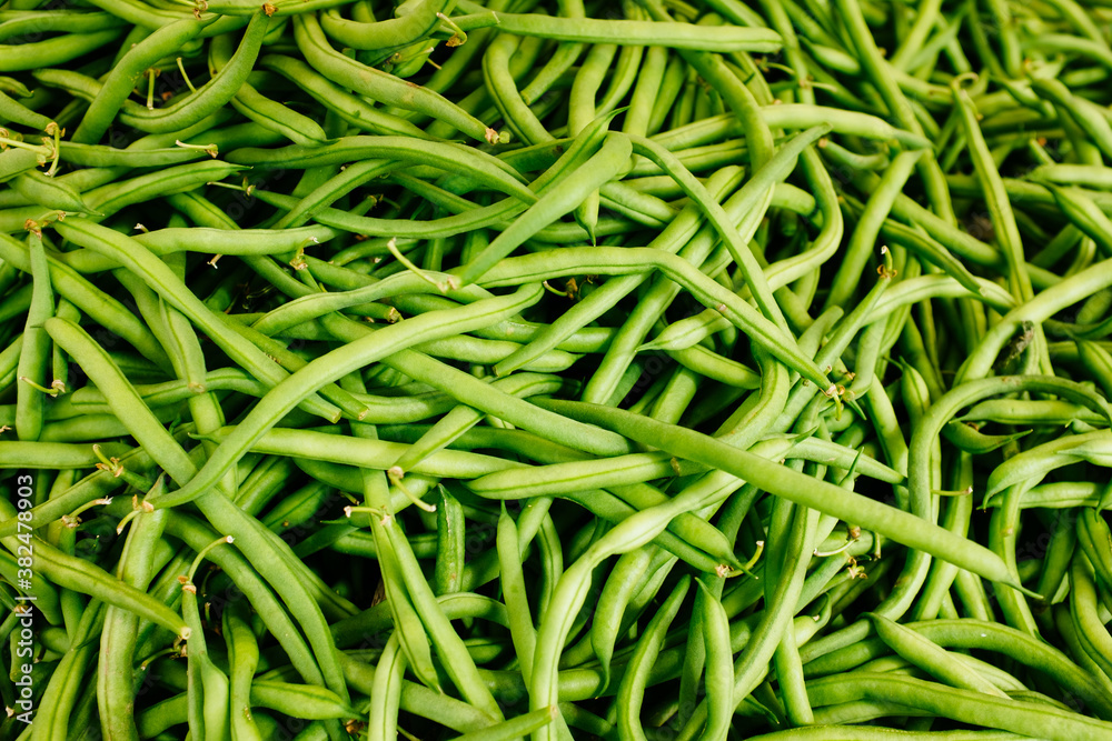 A stack of green beans at a local farmer's market. A stack of green beans at a local farmer's market.