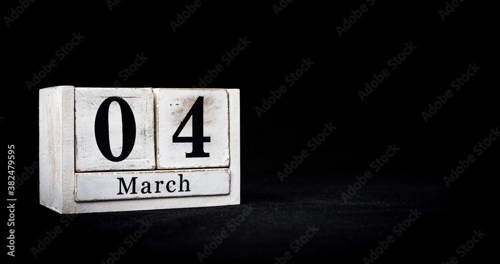 March 4th, Fourth of March, Day 4 of month March - white calendar blocks on black textured background with empty space for text. March 4th, Fourth of March, Day 4 of month March - white calendar blocks on black textured background with empty space for text.