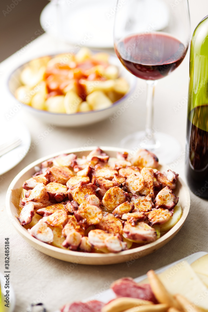 Typical spanish dish with octopus and potato Typical spanish dish with octopus and potato