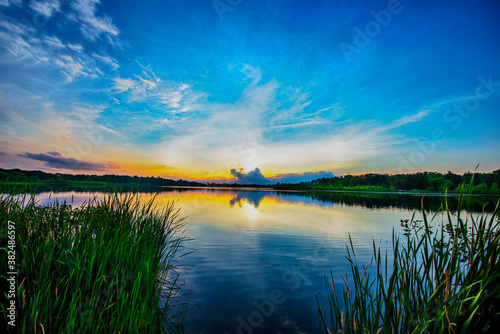 sunset over the lake with clouds