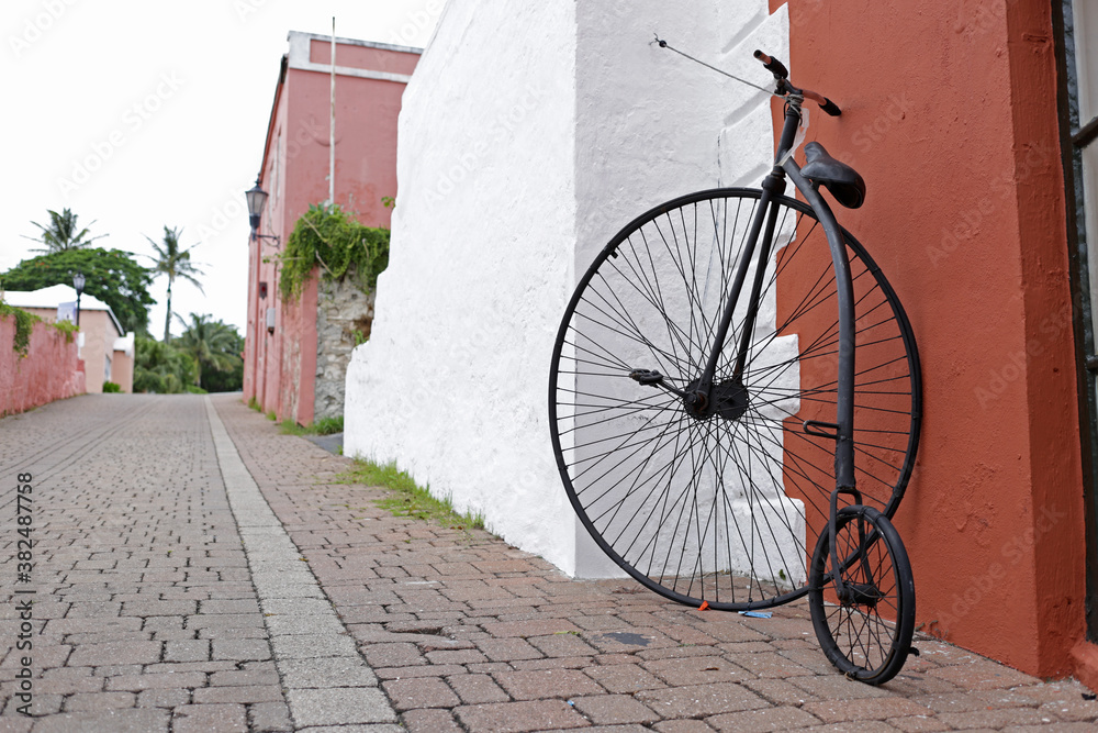 Vintage bicycle with one big wheel and one small.The pennyfarthing