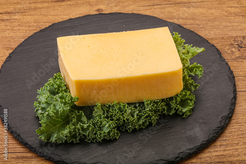 Tasty yelloow Tilsiter cheese brick photo