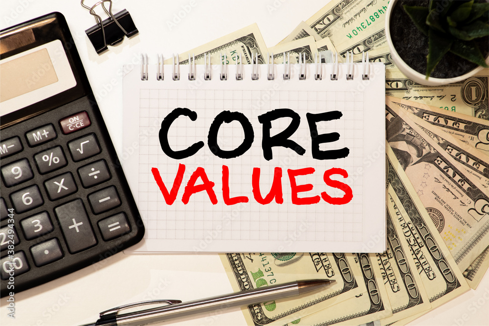 Notebook with text inside Core Values on table Notebook with text inside Core Values on table