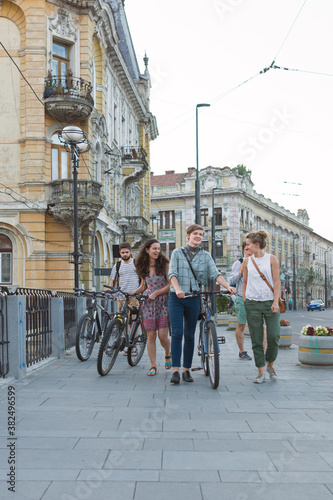 Wallpaper Mural Friends talking and having fun while walking through downtown Torontodigital.ca