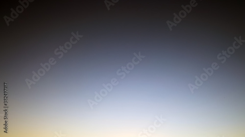 sky background captured in the evening, sky view in dark natural colors with gradient, sky texture without clouds, black, grey and silver colors pattern, space colors, defocus
