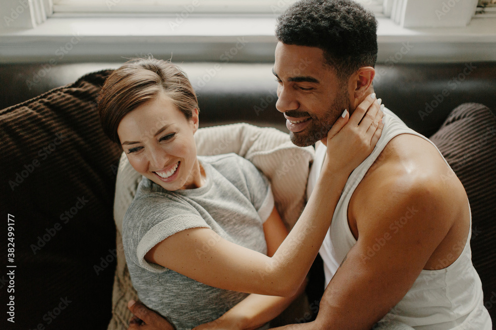Couple Cuddling on Couch Couple Cuddling on Couch