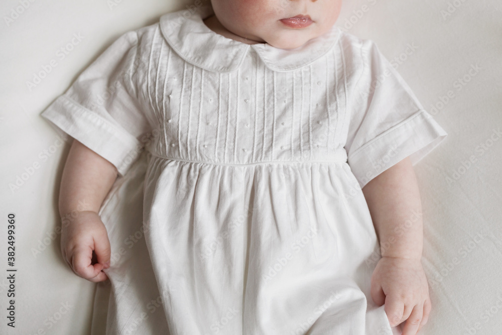 portrait of an infant in white portrait of an infant in white