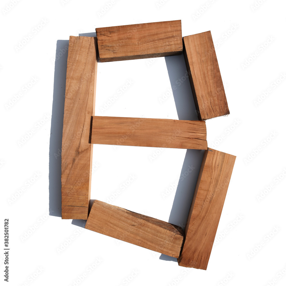 The letter B made of wood blocks on a white background board The letter B made of wood blocks on a white background board