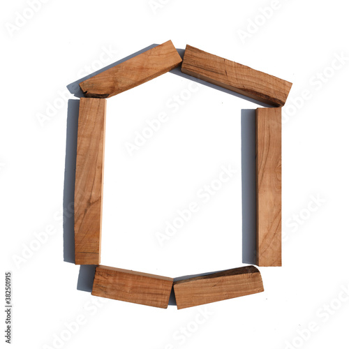 The letter O made of wood blocks on a white background board