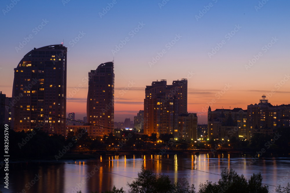 Bright night embankment on the banks of the Dnieper on Obolon