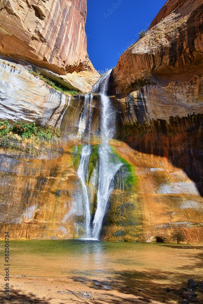Naklejka premium Lower Calf Creek Falls Waterfall colorful views from the hiking trail Grand Staircase Escalante National Monument between Boulder and Escalante in Southern Utah. United States.