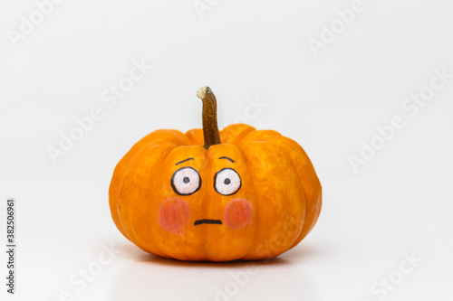 pumpkin with flushed emoticon face