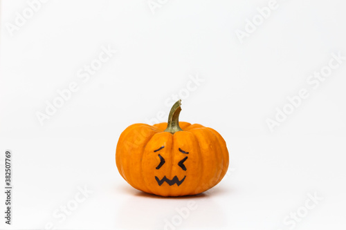 pumpkin with confounded emoticon face
