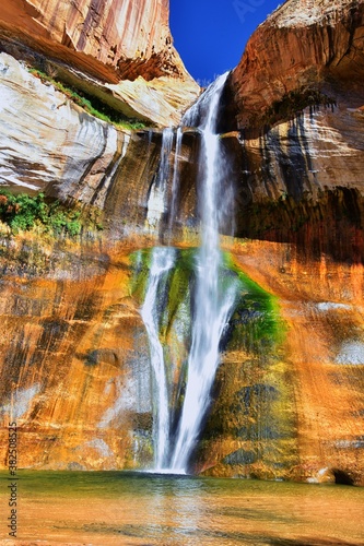 Lower Calf Creek Falls Waterfall colorful views from the hiking trail Grand Staircase Escalante National Monument between Boulder and Escalante in Southern Utah. United States.