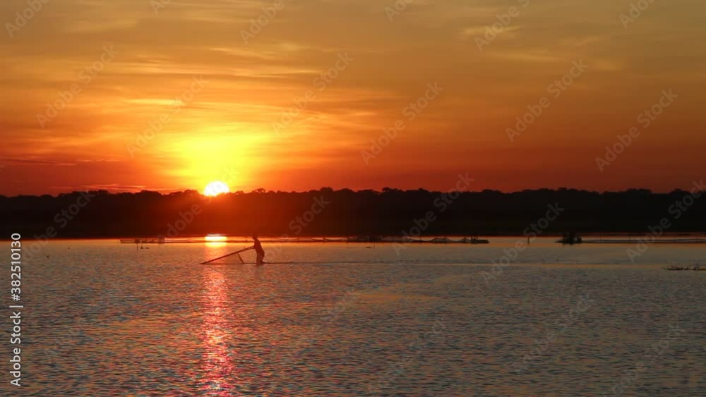 Cambodia. West Lake, a fisherman pulls a net. An artificially dug lake in the 10th century, to supply water to the temples of Angkor in the dry season. Siem Reap city. Siem Reap province. Cambodia. West Lake, a fisherman pulls a net. An artificially dug lake in the 10th century, to supply water to the temples of Angkor in the dry season. Siem Reap city. Siem Reap province.