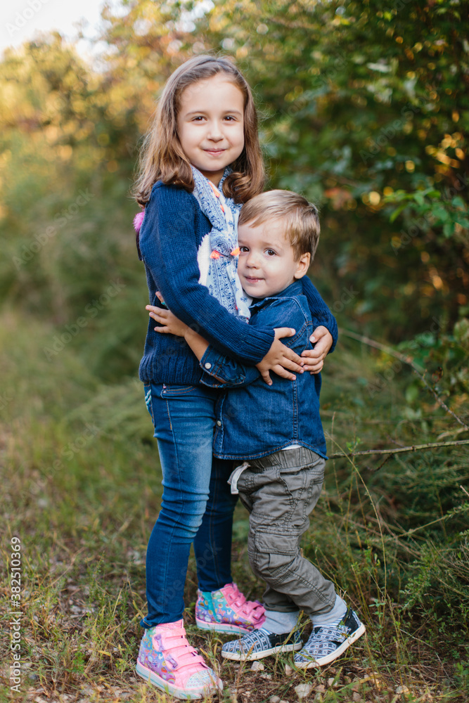Beautiful brother and sister holding each other Beautiful brother and sister holding each other