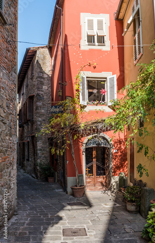 Narrow street Via Tavarnelli in Montecatini Alto  Tuscany  Italy  with the street name on the plate