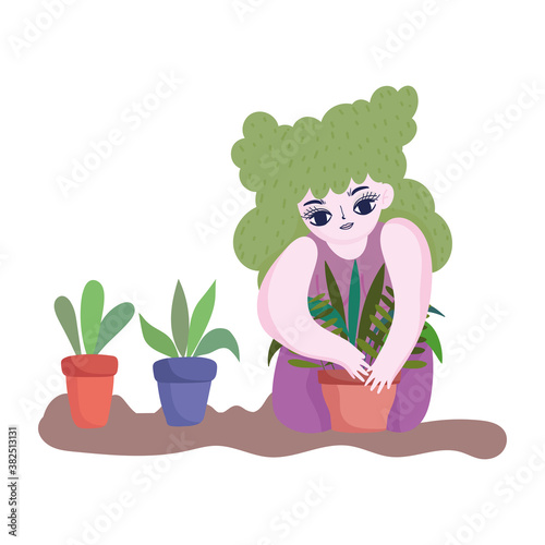 Fototapeta Naklejka Na Ścianę i Meble -  happy garden, girl planting plant in pot white background