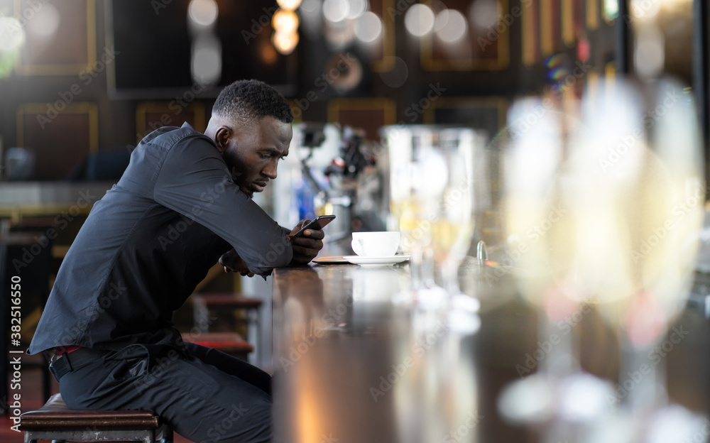 Portrait of confident African American businessman at nightclub.