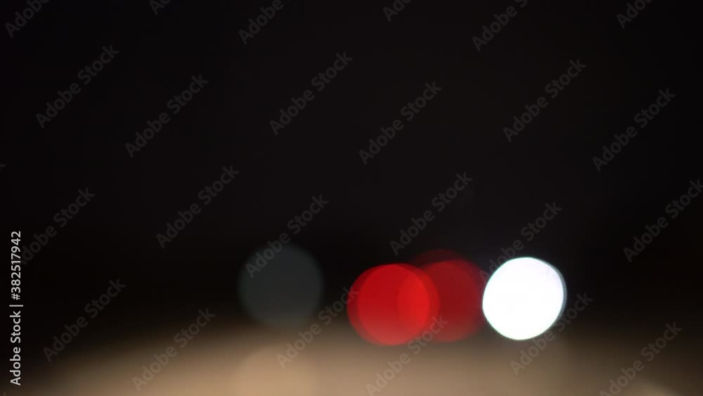 Colorful bokeh lights through car window Colorful bokeh lights through car window