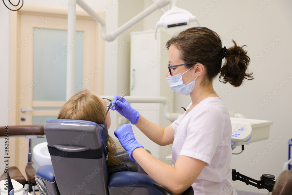 Dentist curing patient Dentist curing patient