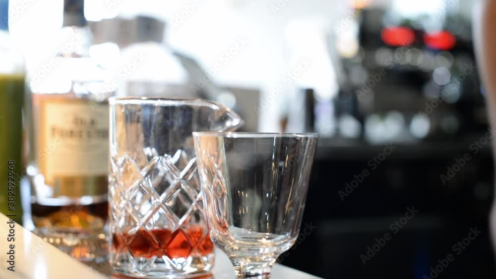 Bartender making cocktails with bourbon, close-up Bartender making cocktails with bourbon, close-up