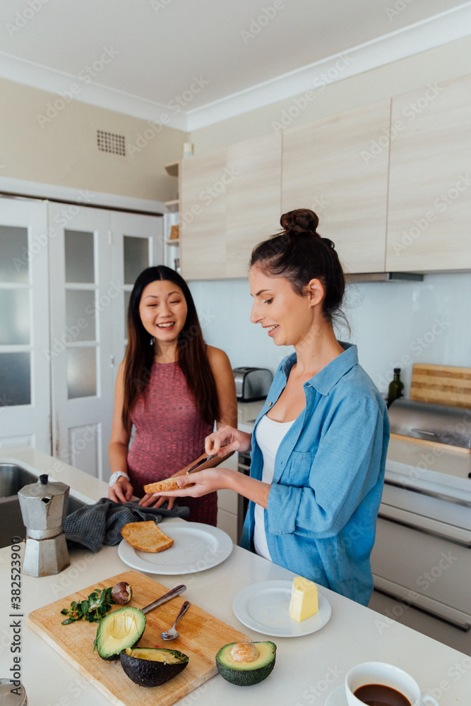 Woman Butters Toast for Friend Woman Butters Toast for Friend