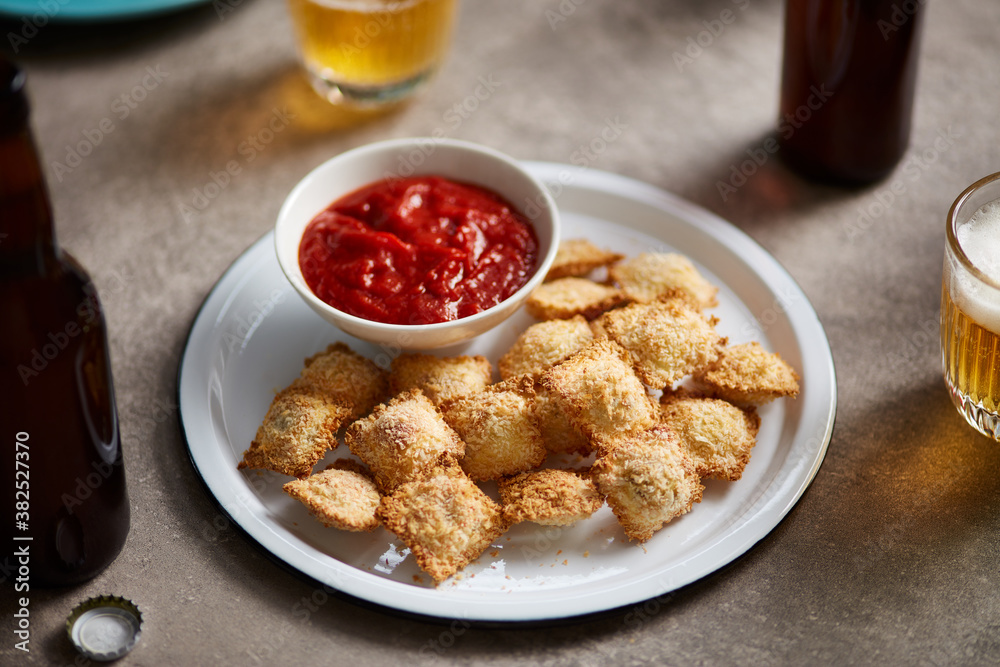 Fried ravioli with tomato sauce. Fried ravioli with tomato sauce.