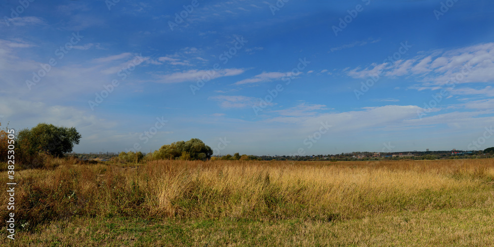 Autumn walks through forests and fields, beautiful panorama.
