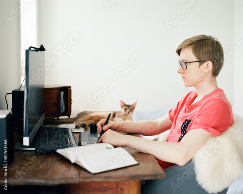 Designer sitting at computer photo