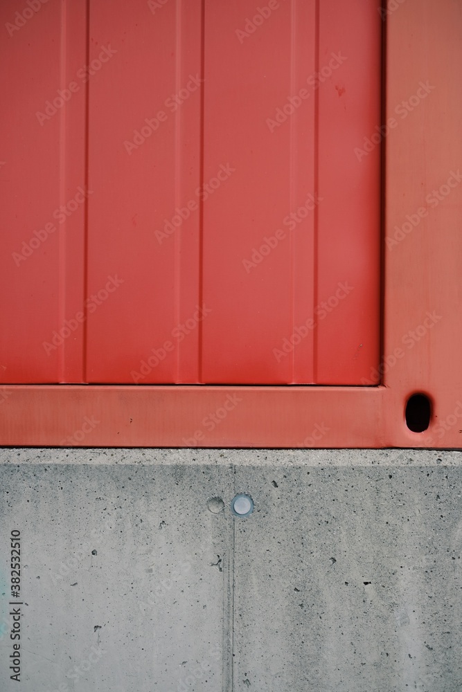 Red metallic structure on a conrete wall. Red metallic structure on a conrete wall.