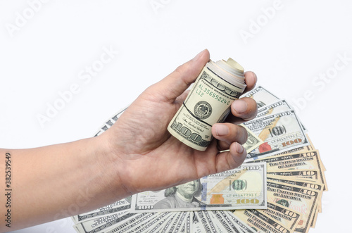 The U.S. dollars banknotes of the united States of America in the hand. The stack of money for the financial concept of earnings or business concept.