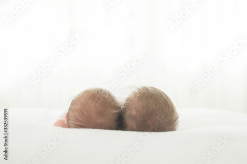 Twin Newborn Babies' Heads photo