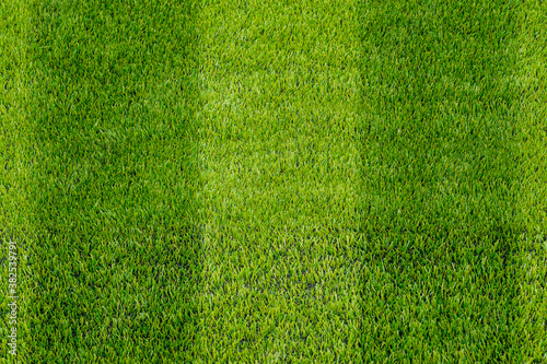 The detail of artificial green grass soccer field for backgroud