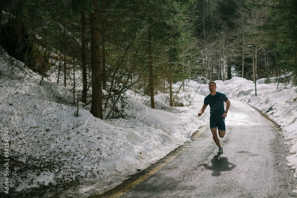 Caucasian man running in a forest Caucasian man running in a forest