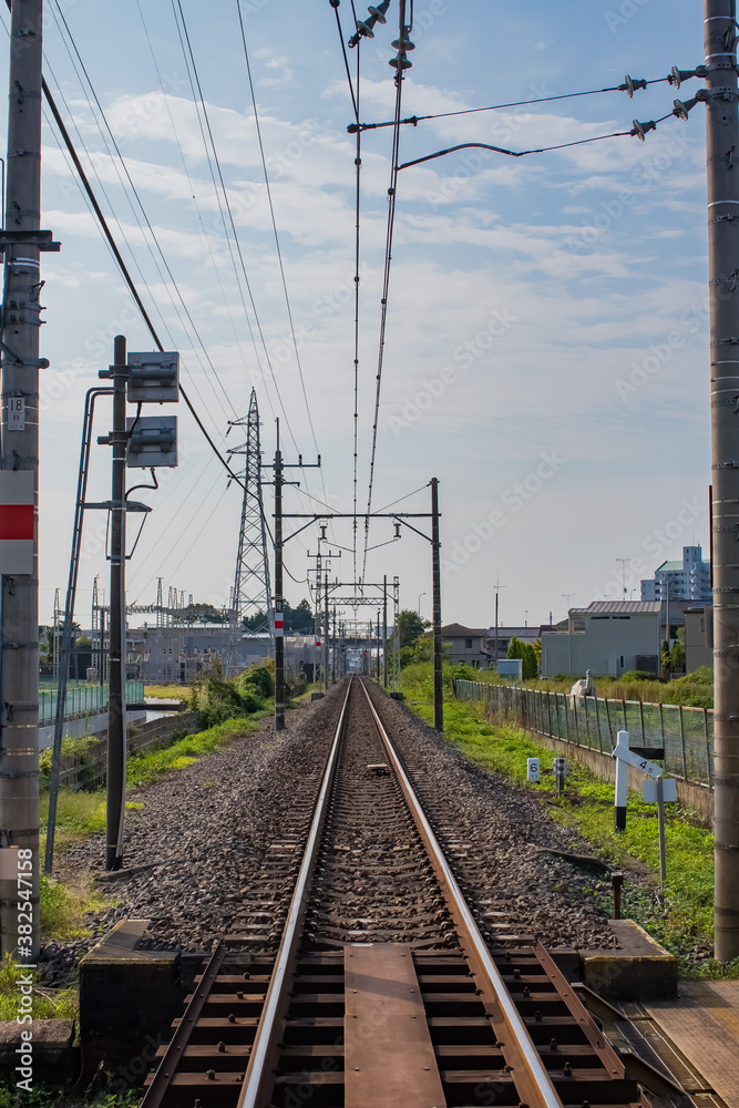 Fototapeta premium straight rails running through the city