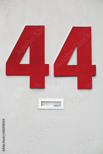 large red letters / numbers 44 forty four on the side of a building photo