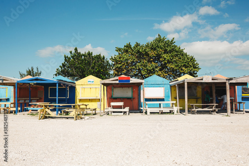 Row of colorful buildings in tropical location photo