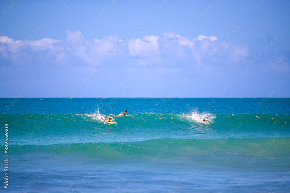 Surfing at Hanalei Beach, Kauai, Hawaii