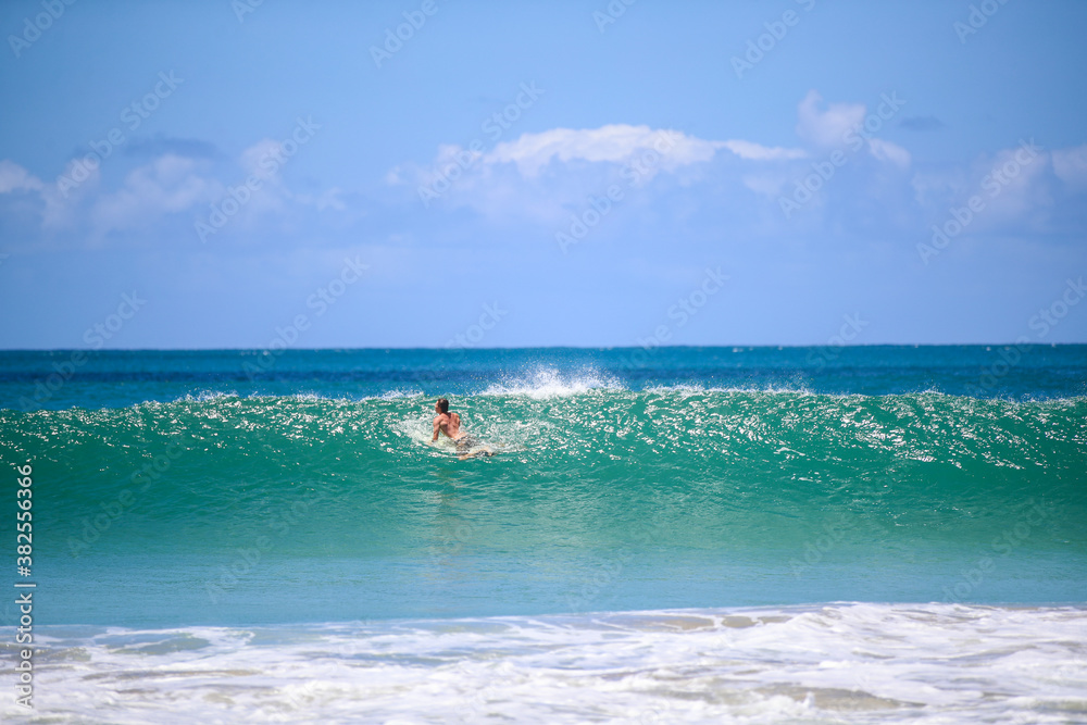 Surfing at Hanalei Beach, Kauai, Hawaii