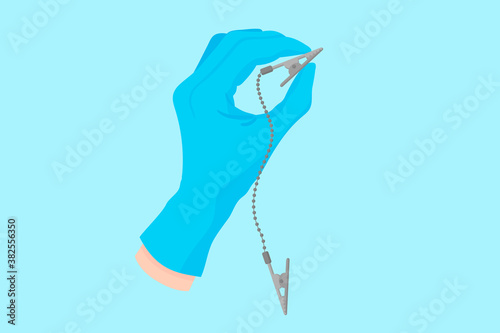 Vector cartoon hand of a dentist in a blue glove that hold a dental clip holder for chest napkins.