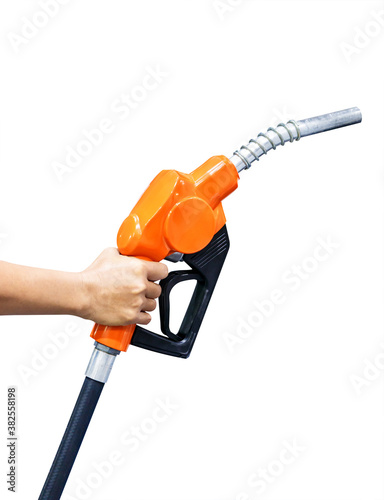 Hand holding orange fuel nozzle isolated on white background photo