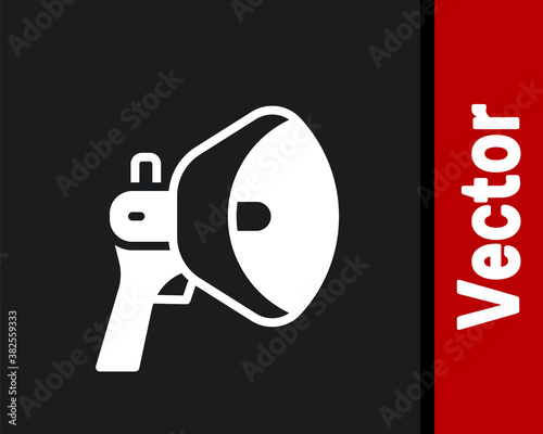 White Megaphone icon isolated on black background. Speaker sign. Vector. photo