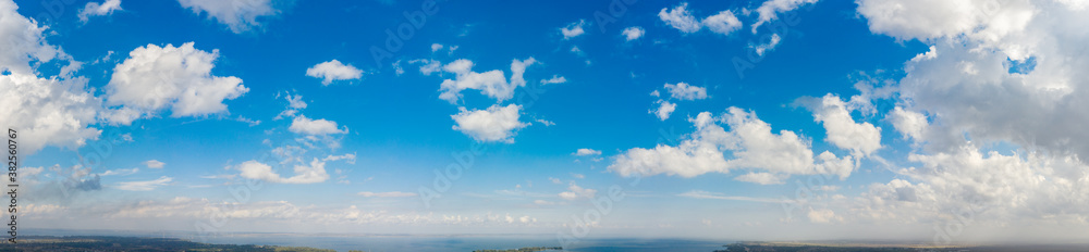 Wide sky panorama with scattered cumulus clouds Wide sky panorama with scattered cumulus clouds