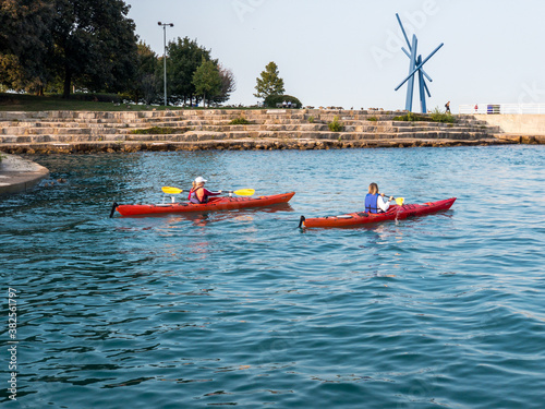 people kayaking on Lake Michigan in Chicago leaving Diversey Harbor to go out to the lake