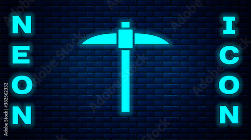 Glowing neon Pickaxe icon isolated on brick wall background. Blockchain technology, cryptocurrency mining, bitcoin, digital money market, cryptocoin wallet. Vector.