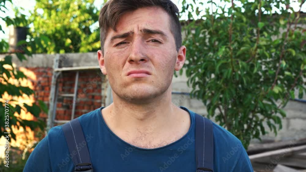 tired Builder takes off his glasses and helmet tired Builder takes off his glasses and helmet